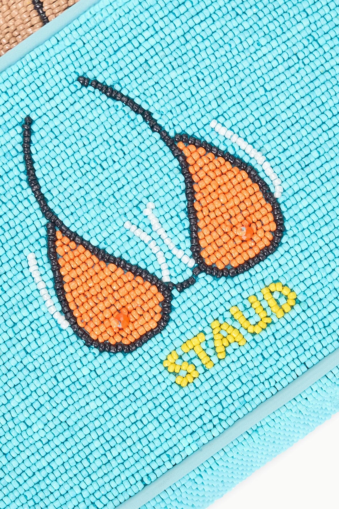 TOMMY beaded beach bag closeup of light-blue beetle motif with orange wings