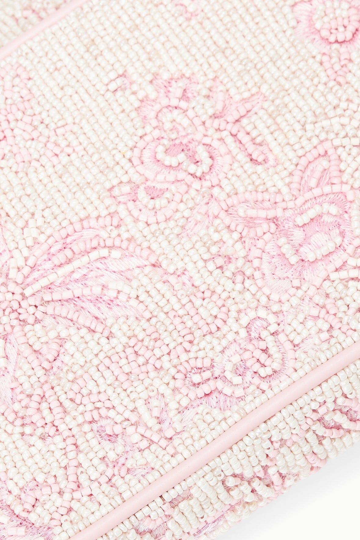 Beaded fabric panel detail with pink cherry blossom toile pattern