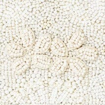 White beaded handbag fabric texture with small bead pattern detail.