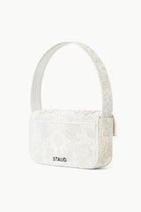 White beaded mini handbag with top handle and side strap detail, zipper closure.