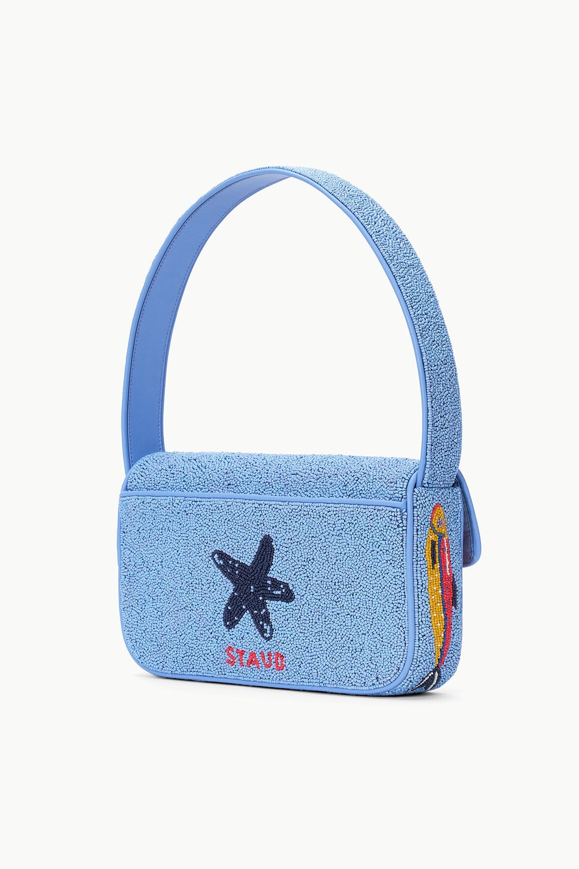 Light blue beaded mini bag with handle and star patch on the front