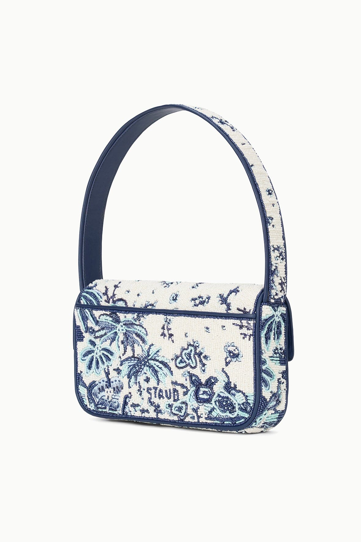 Angled view of small blue-and-cream toile beaded bag with top handle
