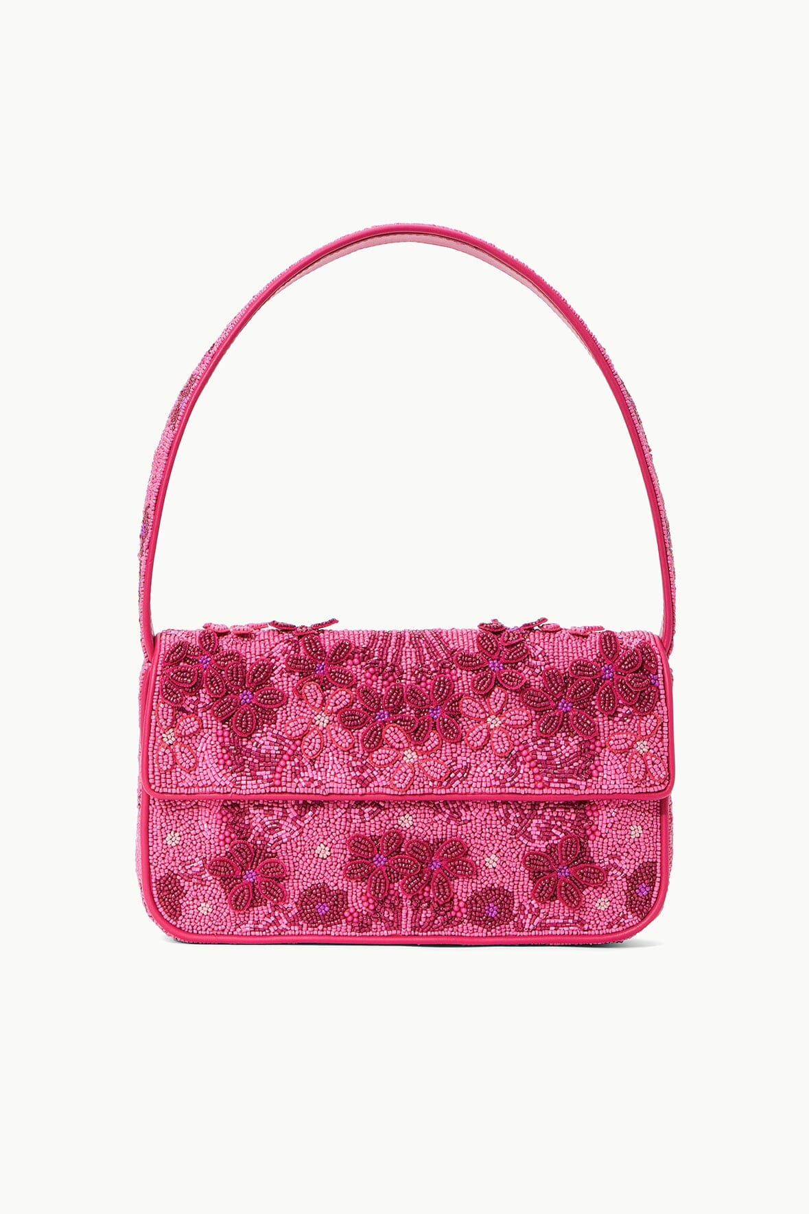 Pink beaded handbag with short top handle and flap closure, floral pattern.