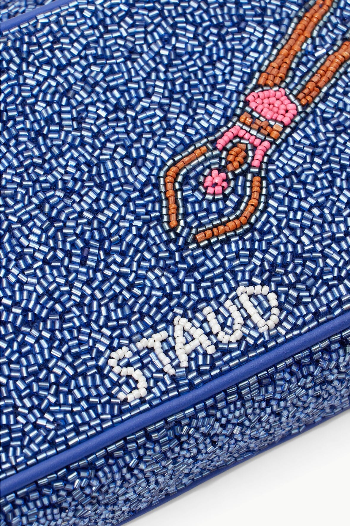 Beaded surface detail in blue with multicolor swimmers motif and beaded trim