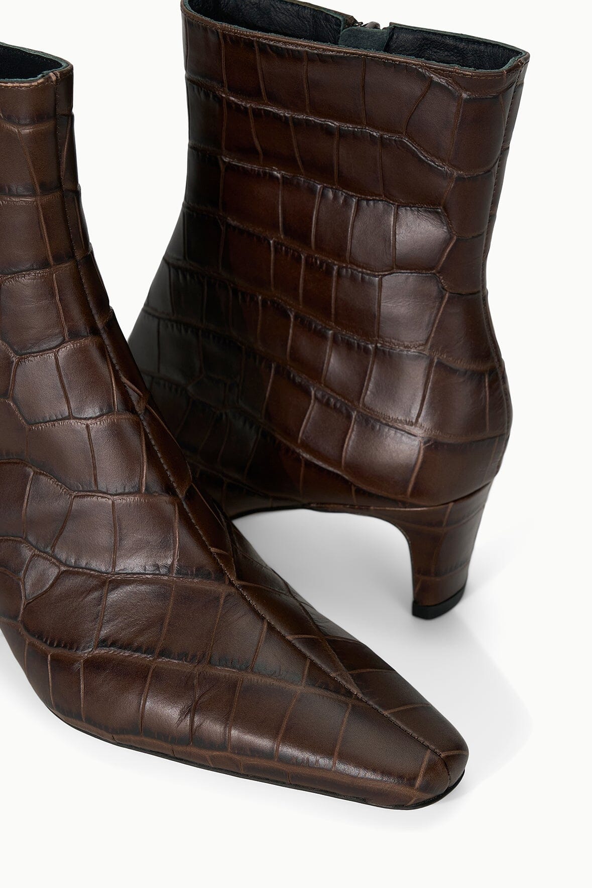 Pair of espresso-brown croc-texture ankle boots with mid-height slim heel