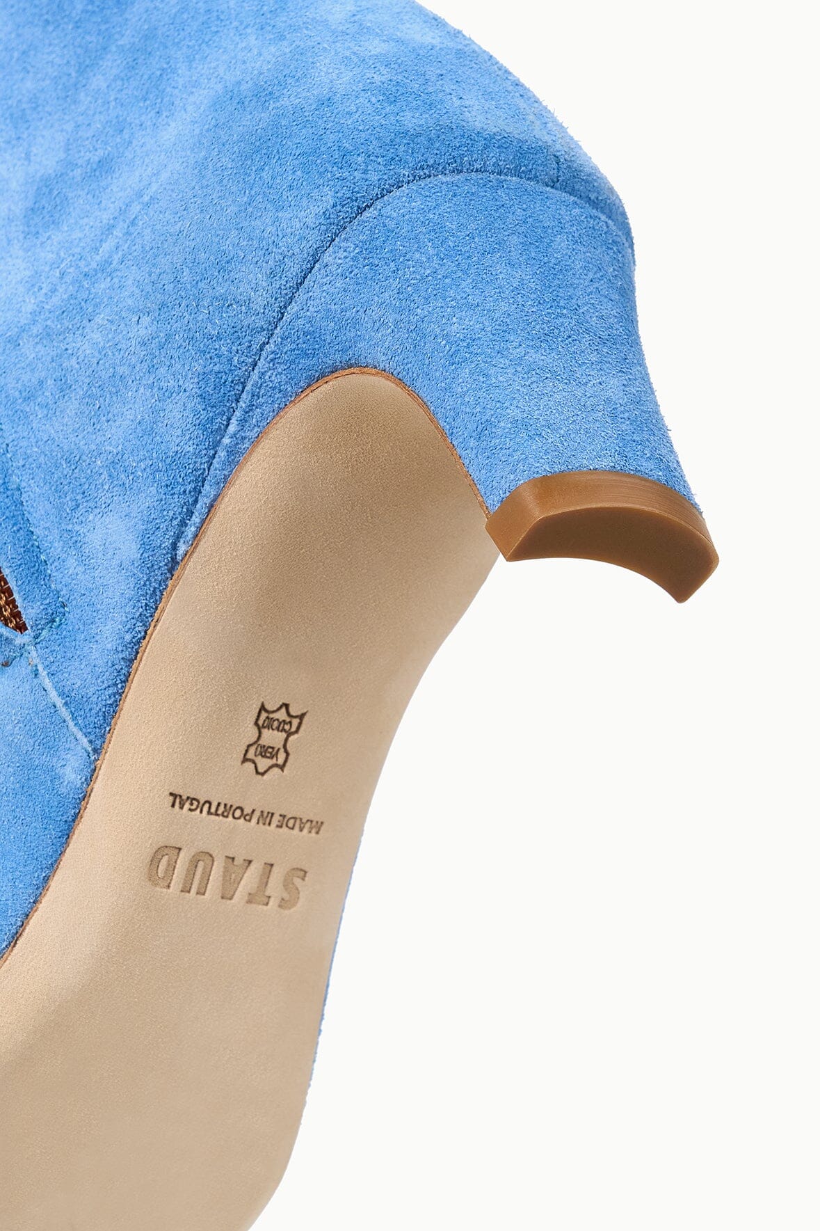 Blue suede ankle boot interior lining with brand stamp at heel