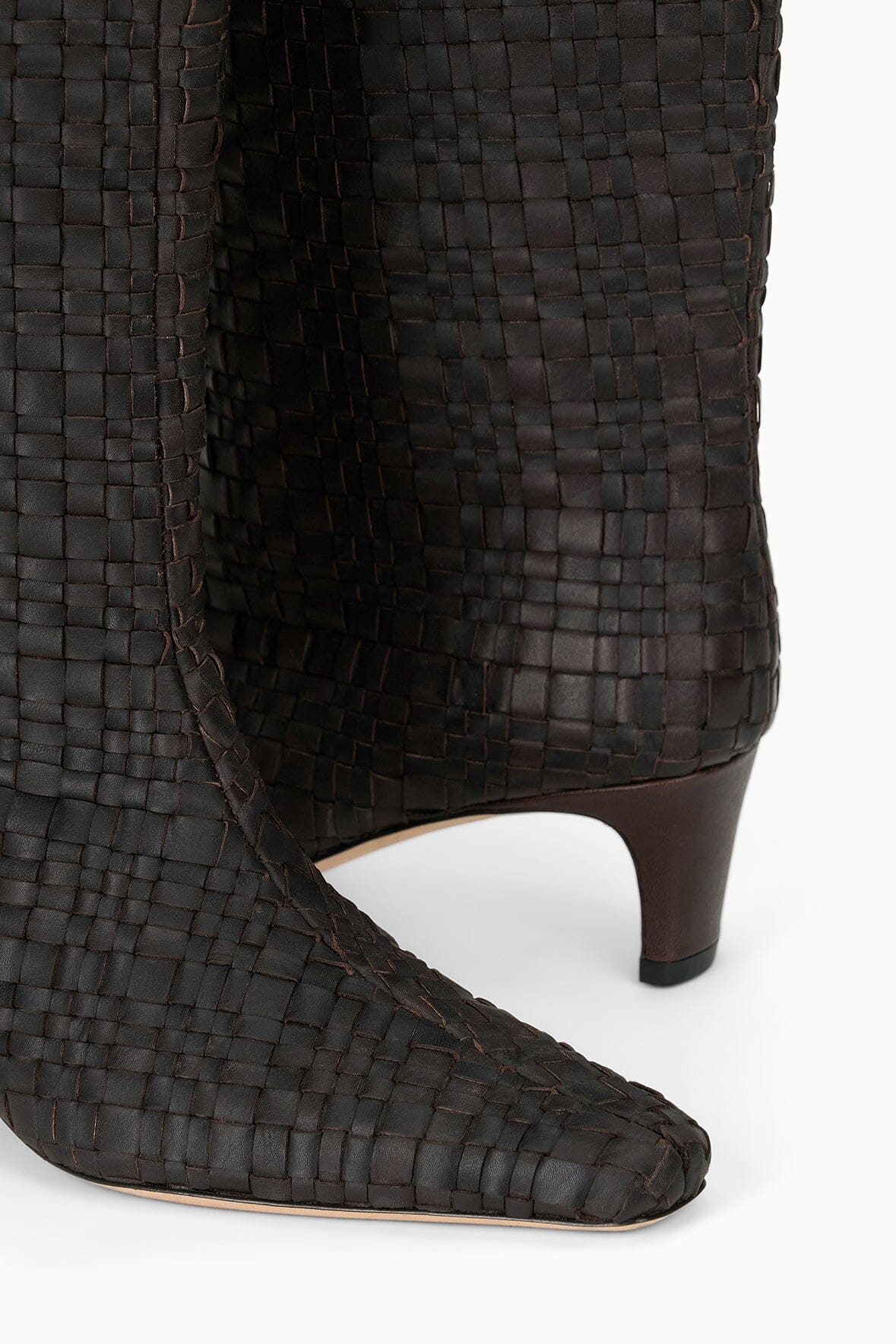 Woven leather tall boot with pointed toe and slim low heel, dark espresso brown.