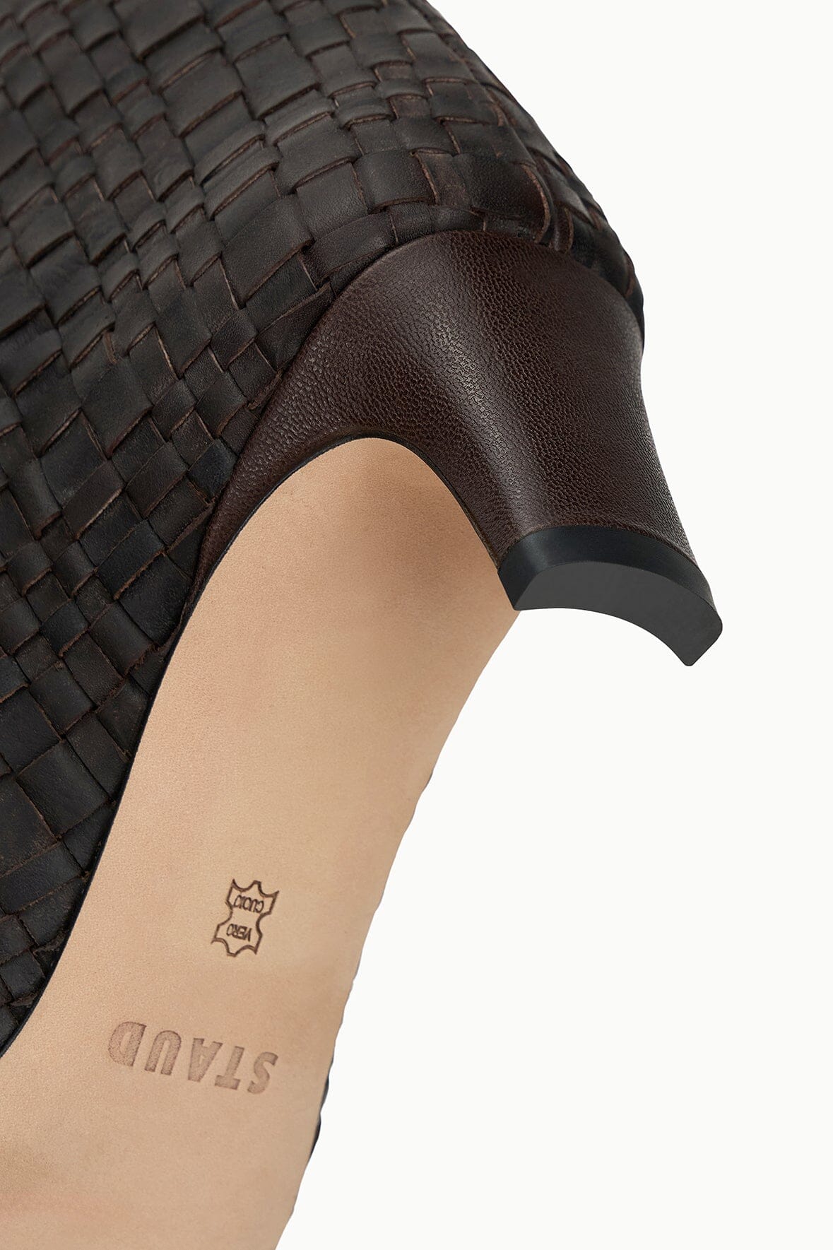 Close-up of woven leather boot upper in dark espresso brown with low heel.