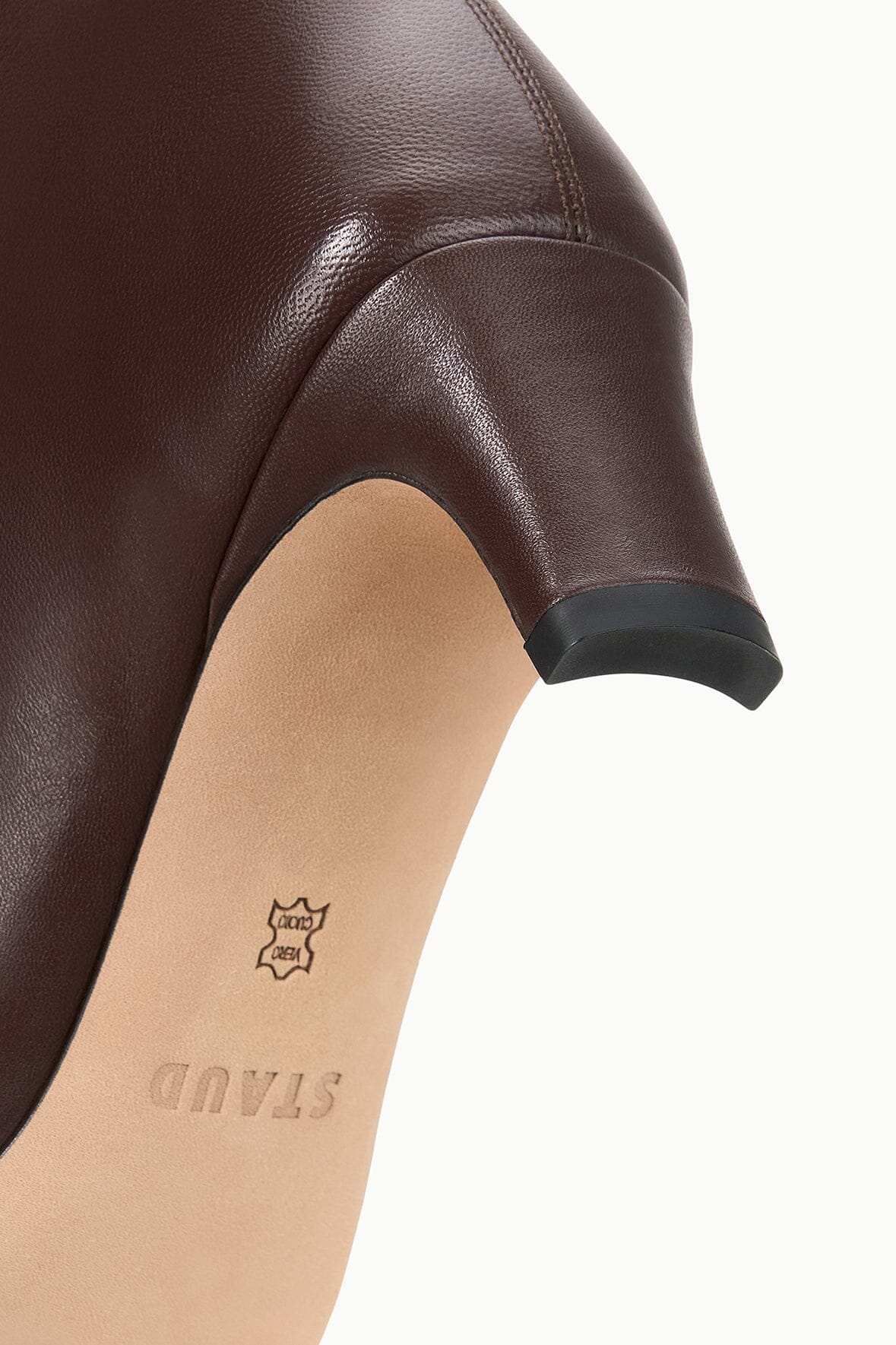 Espresso brown boot shaft detail with small logo on light insole