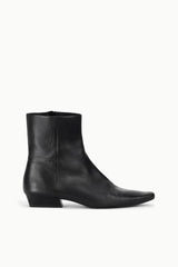 Black flat ankle boot with pull-on design and low block heel