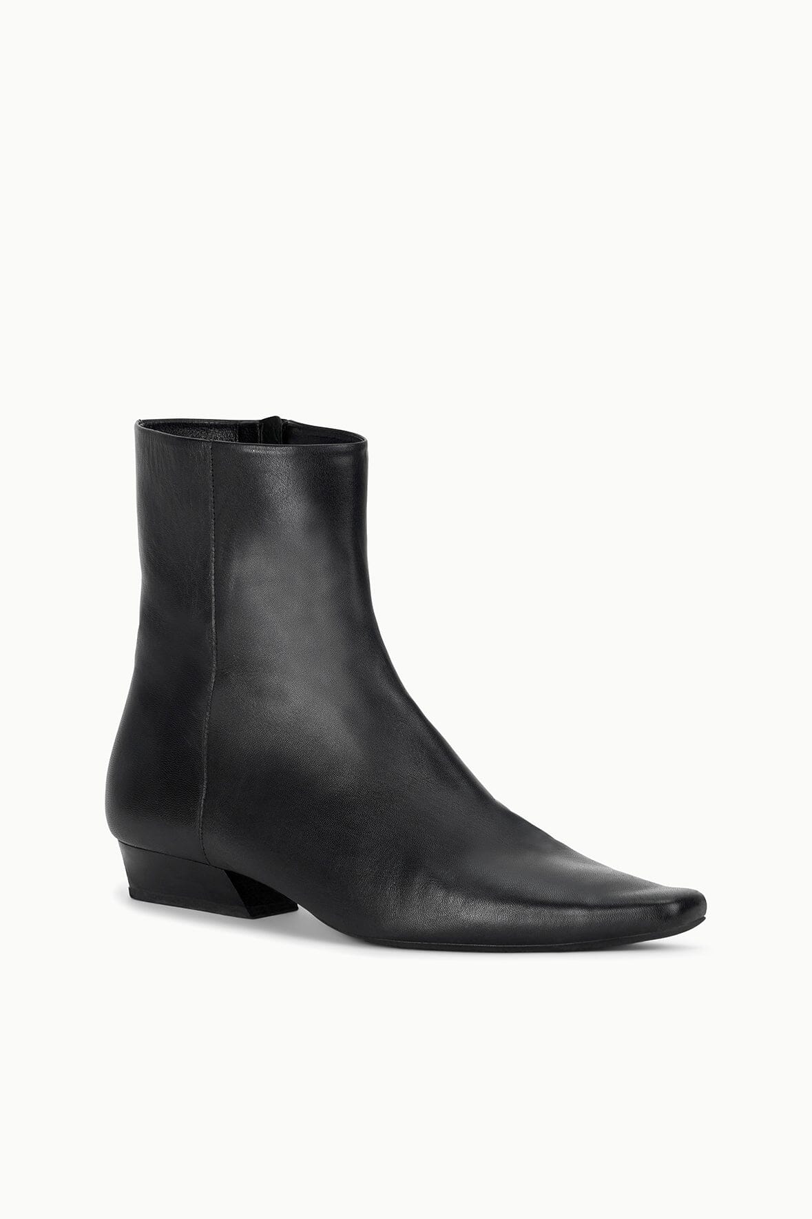 Black flat ankle boot with angled side profile and low block heel
