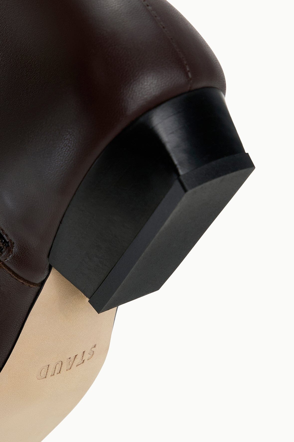 Espresso brown ankle boot heel with black block base and stitched trim