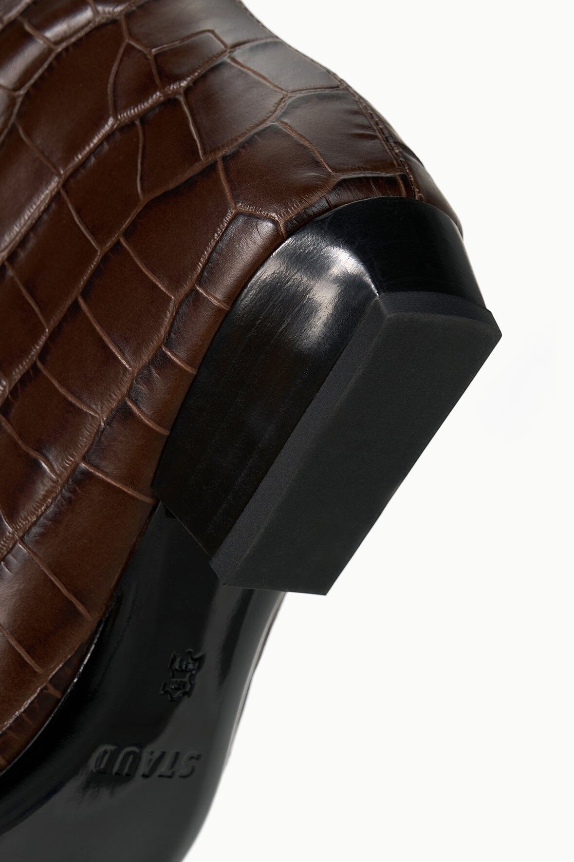 Espresso brown croc-effect boot heel with black outsole and embossed logo