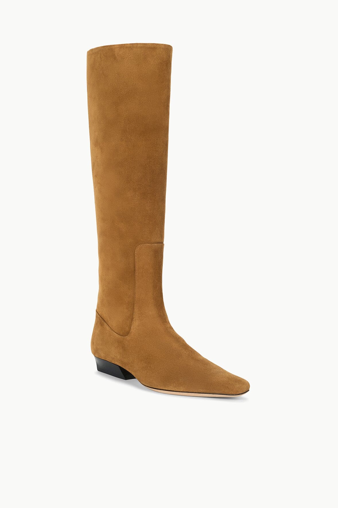 Tan suede flat knee-high boot with curved toe and low stacked heel