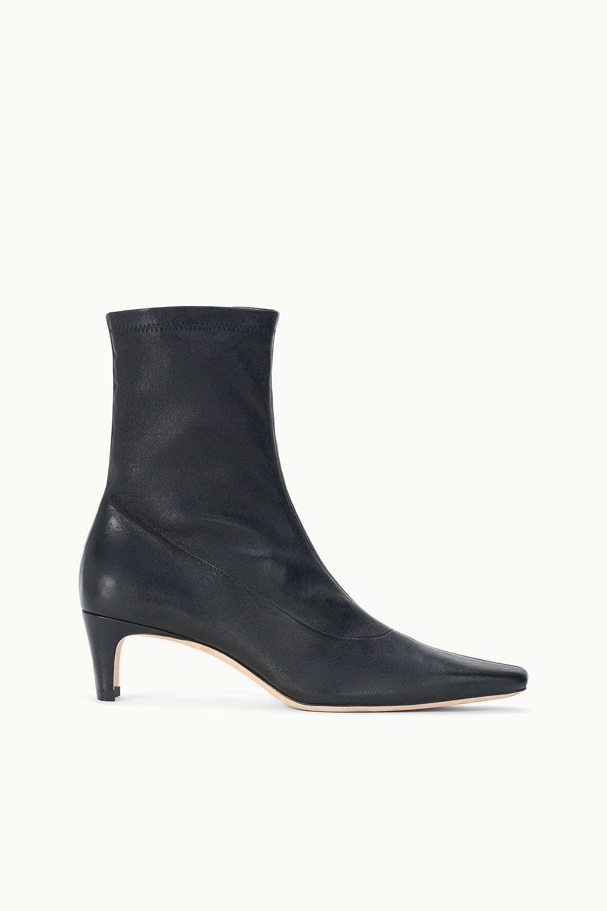 Black ankle sock boot with tapered toe and low block heel.