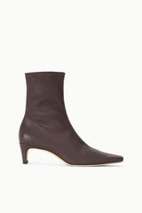 Espresso dark brown pointed-heel ankle boot with sock-like upper and curved toe