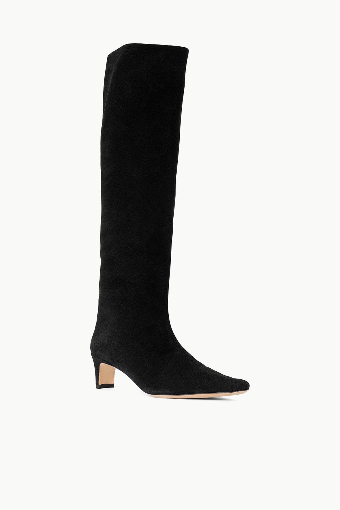 Black suede knee-high boot side view with low heel and sleek toe