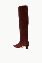 Mahogany suede knee-high boot in side view with low block heel