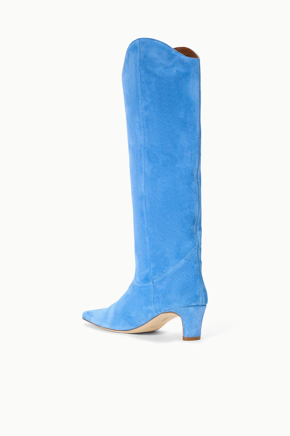 Light blue suede tall boot with pointed toe and mid-height stacked heel