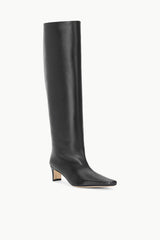 Wide-shaft black knee-high boot, side profile, pointed toe and block heel