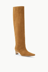 Tan suede tall boot with wide shaft, low block heel, and pointed toe