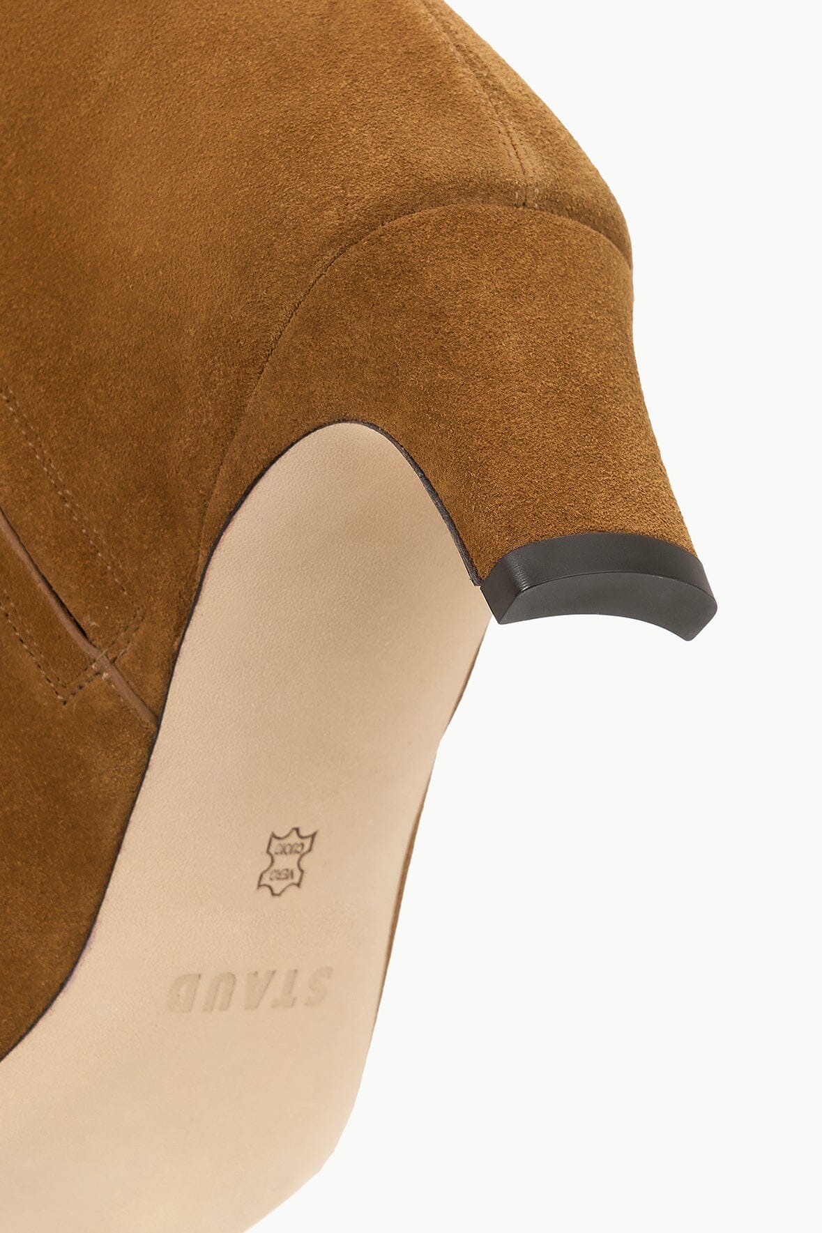 Tan suede boot insole with brand logo detail under cuff