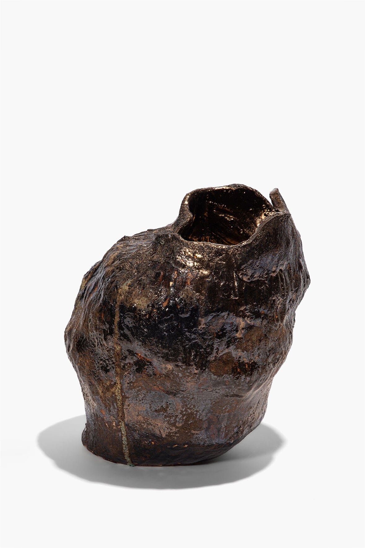 Small organic ceramic vase with dark brown textured glaze and curved open top