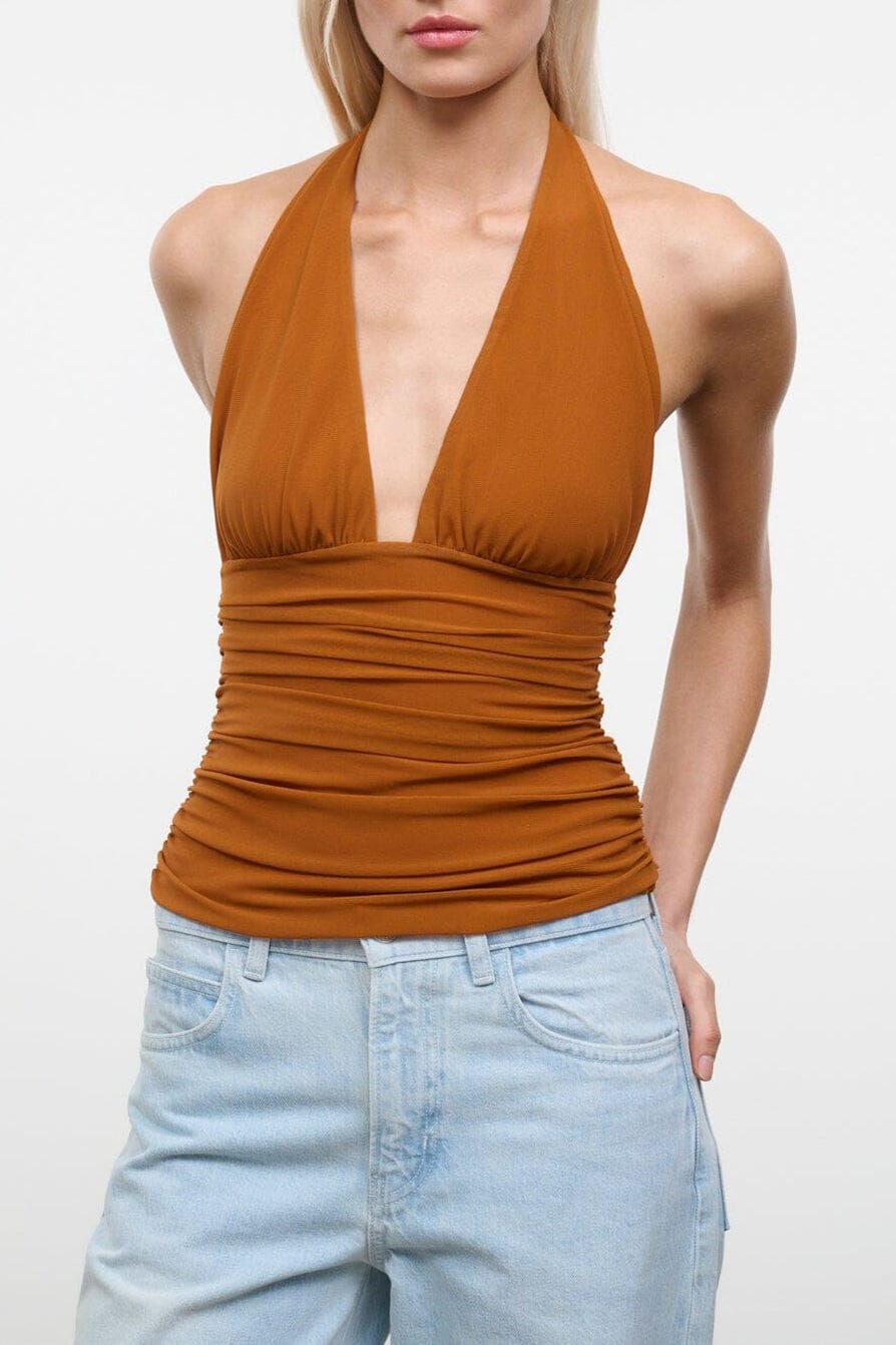 Halter ruched knit top with deep V neckline, warm orange