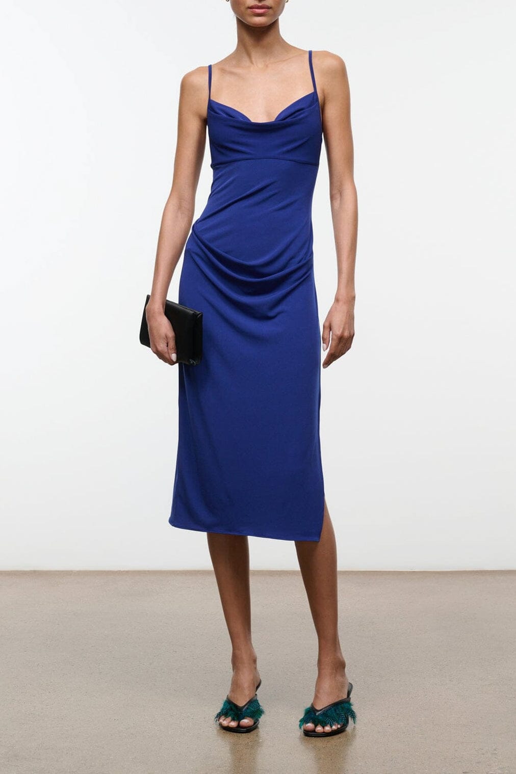 ASHE midnight midi dress with spaghetti straps, draped cowl neckline, fitted silhouette