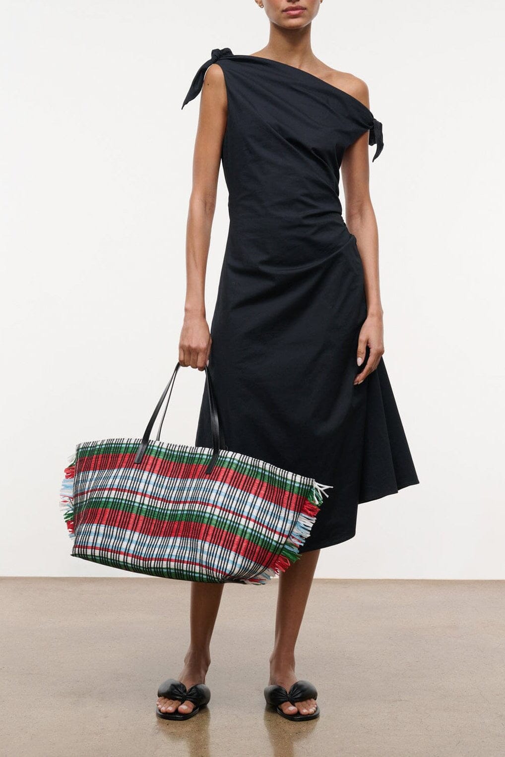 Black midi wrap dress with off-shoulder drape and side bow ties