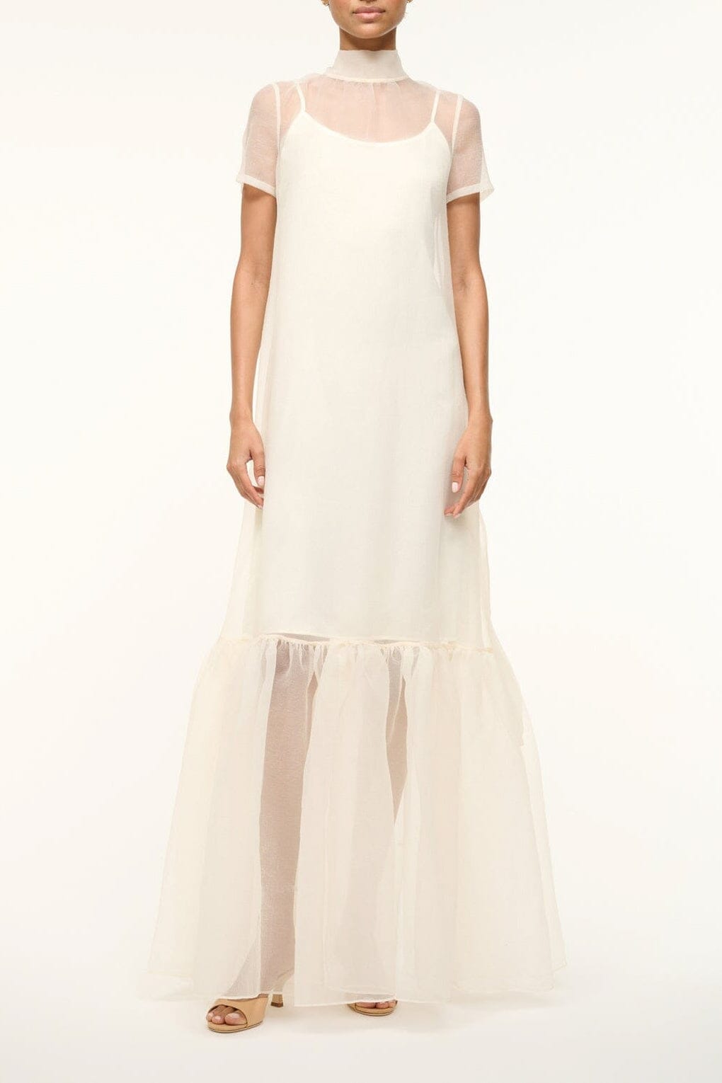 White maxi dress with short sheer sleeves and tiered ruffle hem