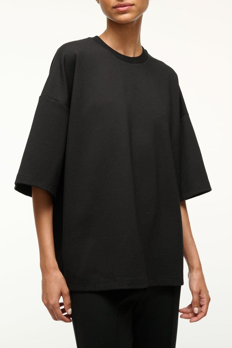 Black capsule top with crew neck and short loose sleeves