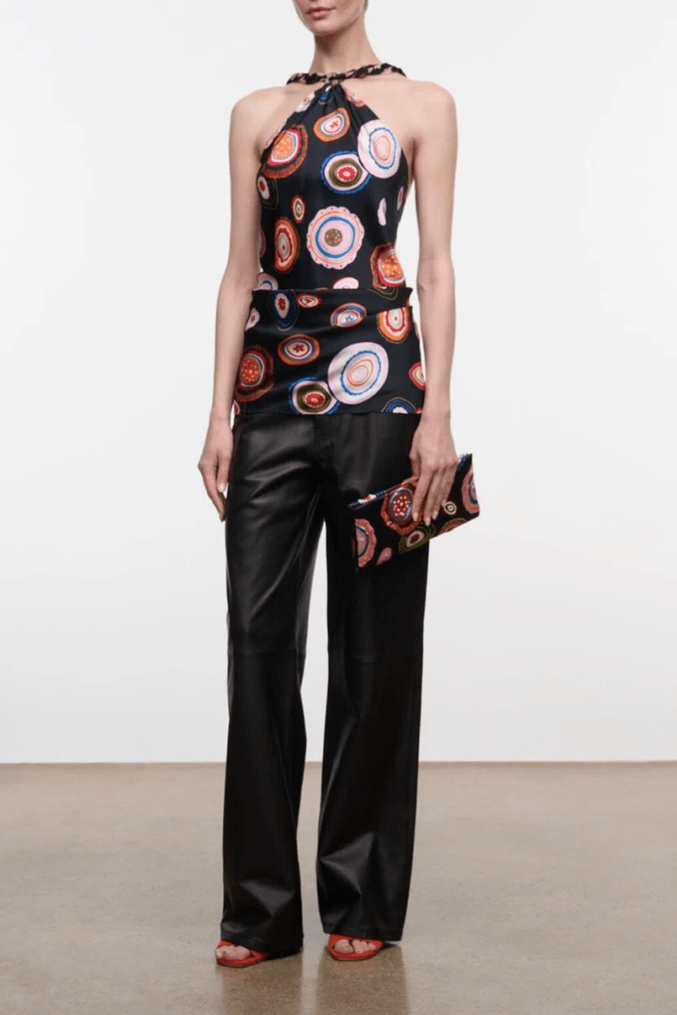 Charli silk halter top with multicolor circular print on dark fabric