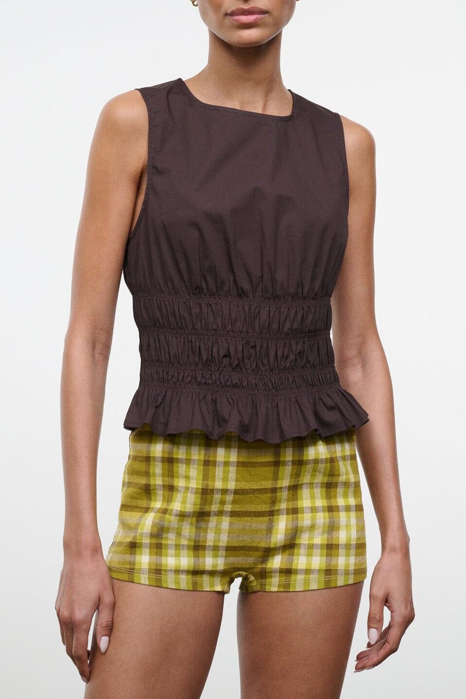 CULVER top in dark brown, sleeveless with elastic waist and ruffled peplum hem