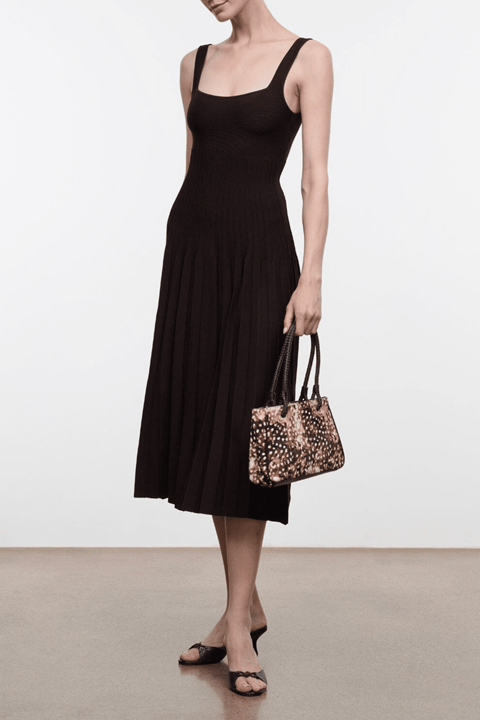 Women’s sleeveless midi dress, scoop neckline, dark brown knit; pleated skirt