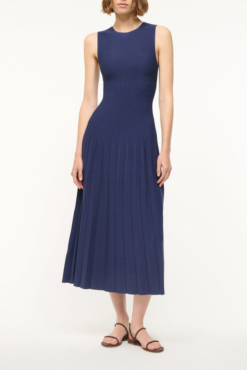 Navy sleeveless midi knit dress with crew neck and gathered pleated skirt