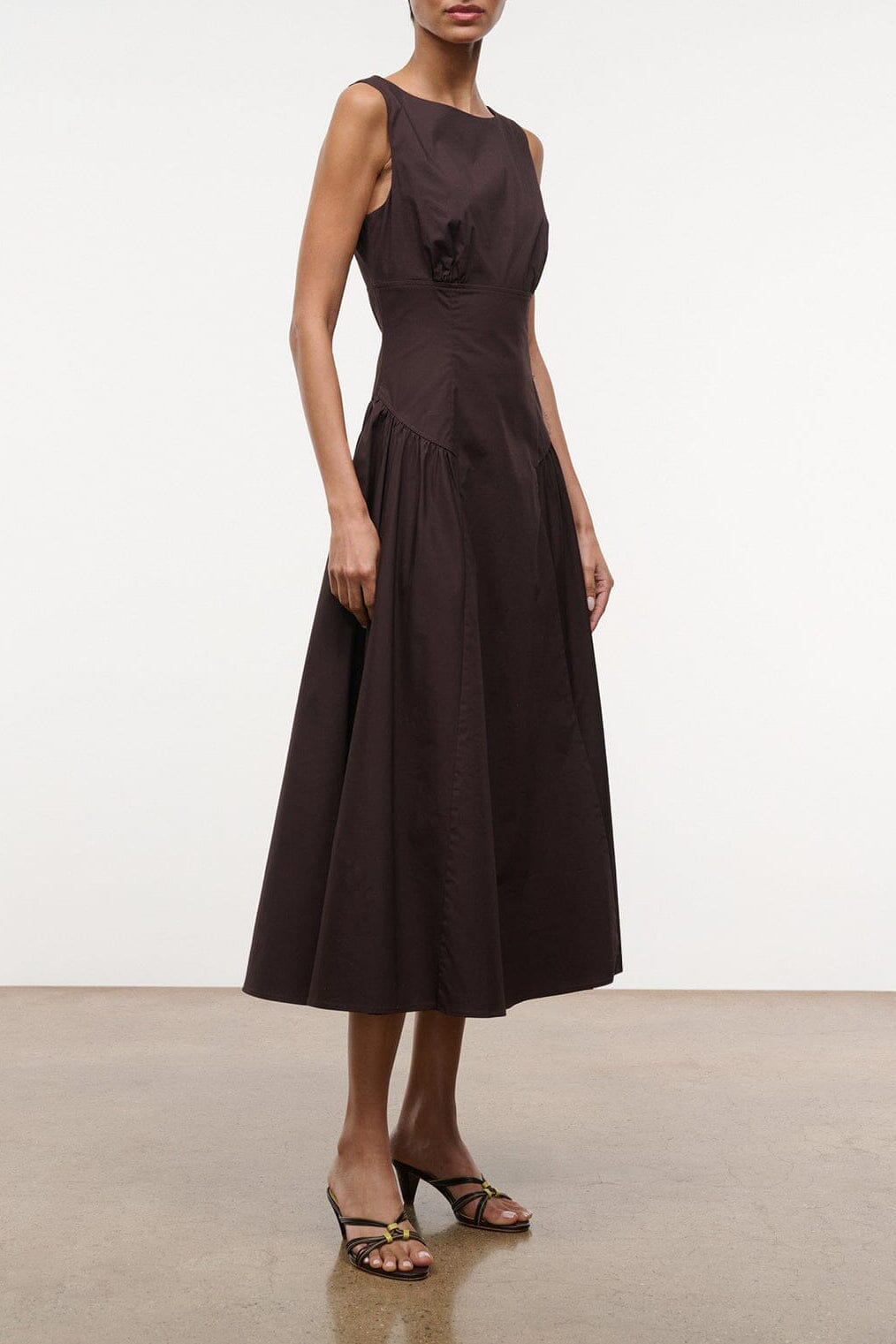 Sleeveless midi dress in dark brown with fitted bodice and flared skirt
