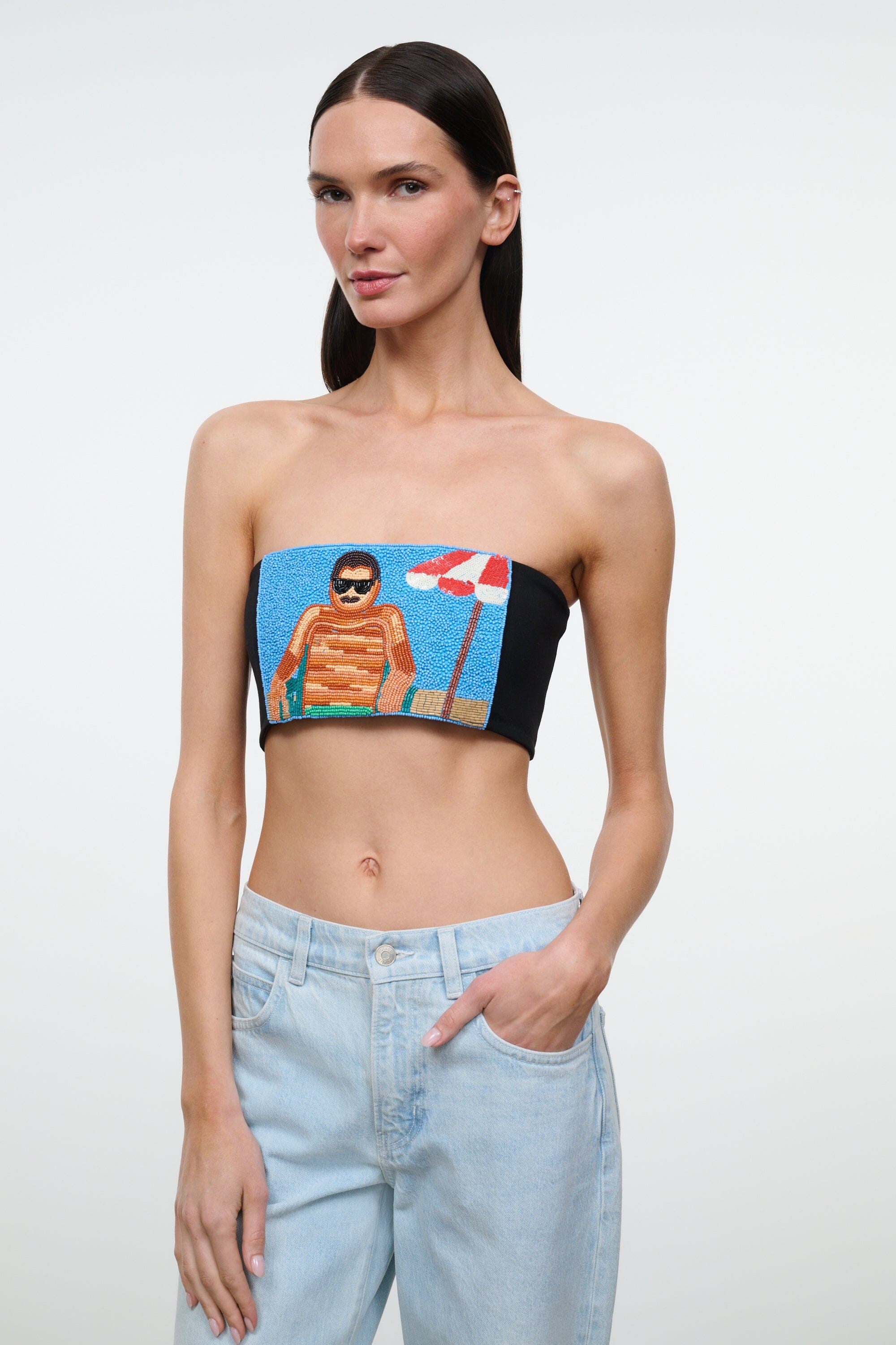Black strapless tube top with colorful portrait graphic, cropped and fitted