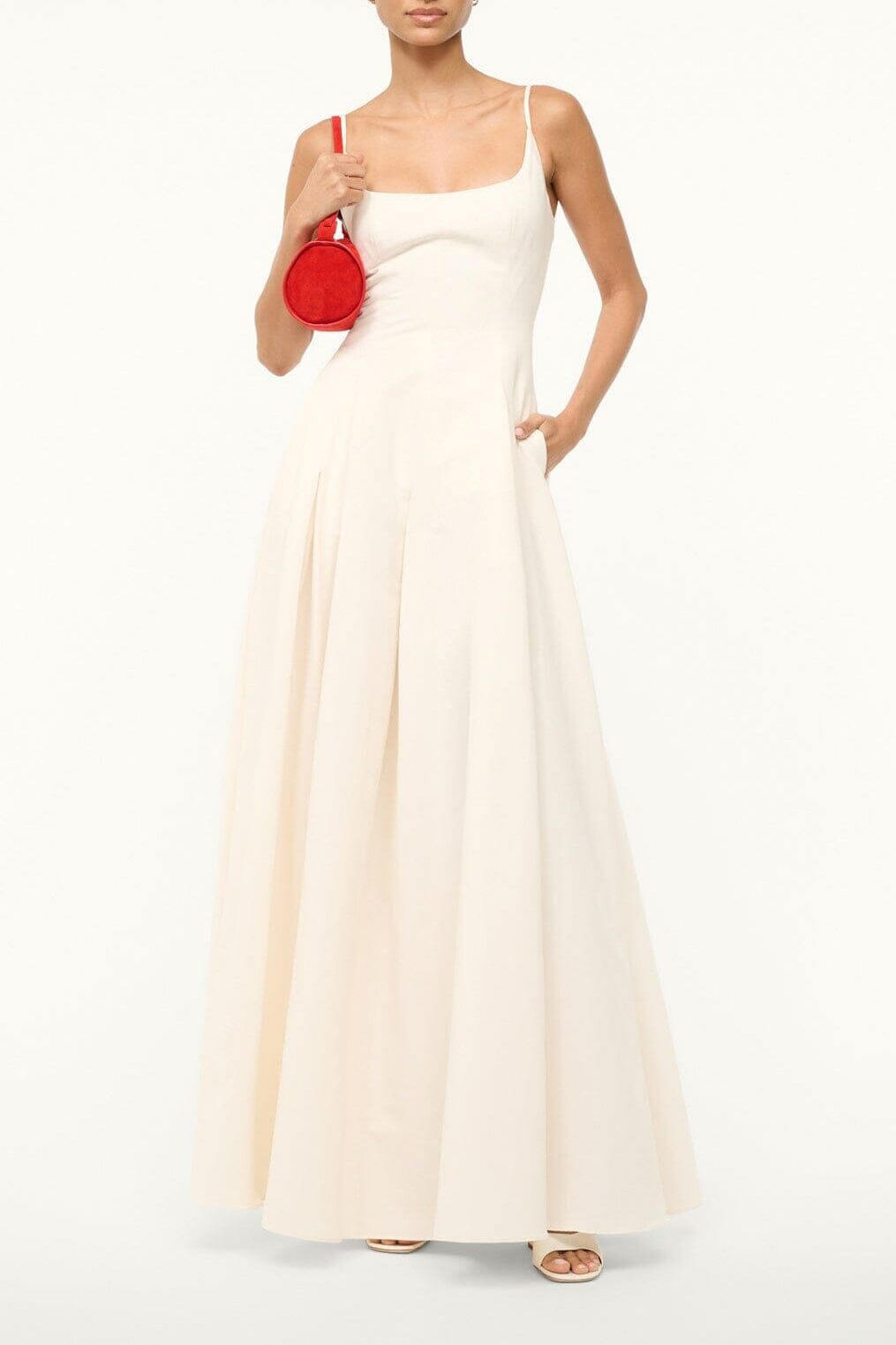 Ivory sleeveless maxi dress with thin straps and flared skirt