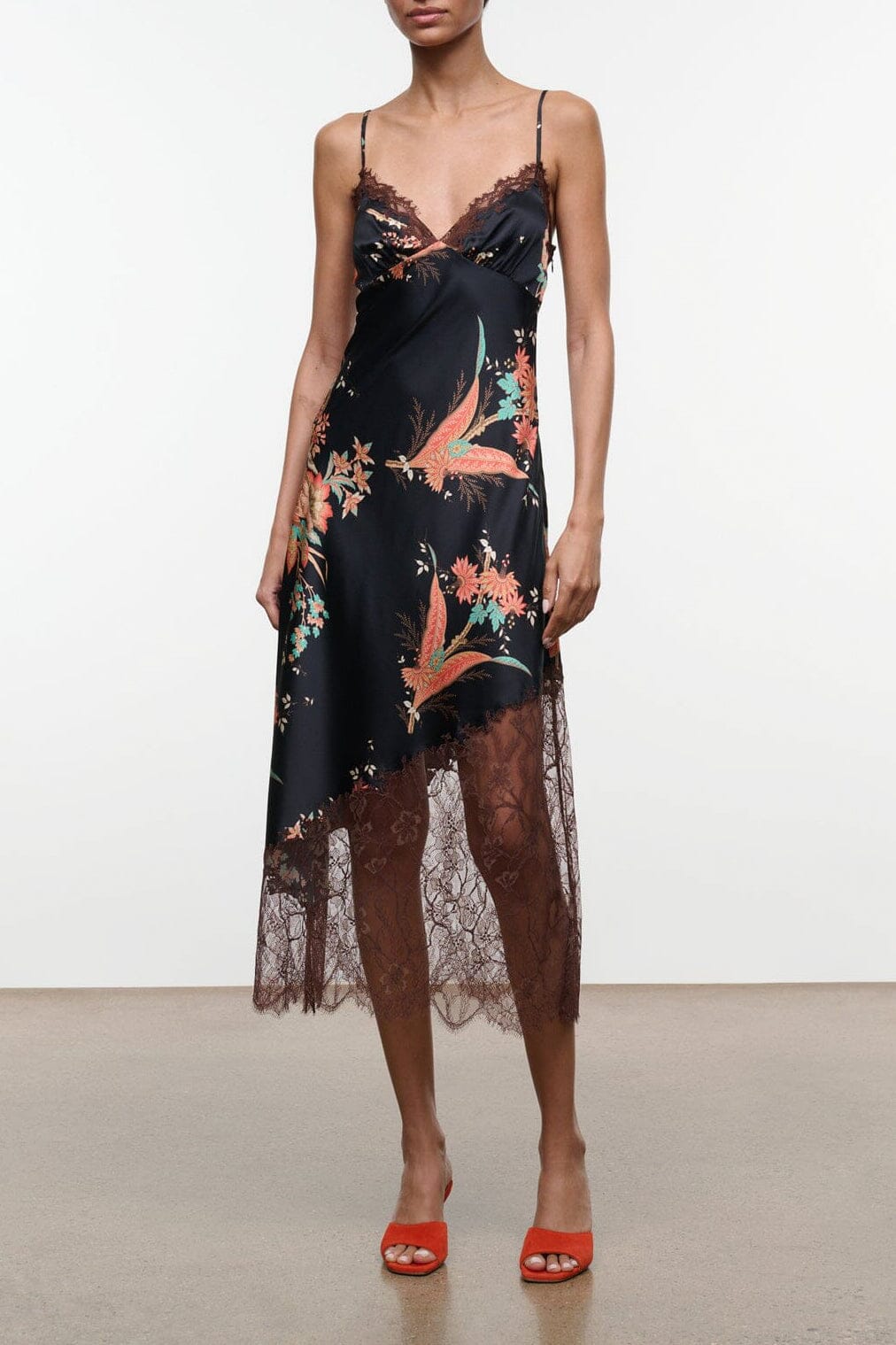 Black silk slip dress with spaghetti straps, floral bird print, lace hem, midi length
