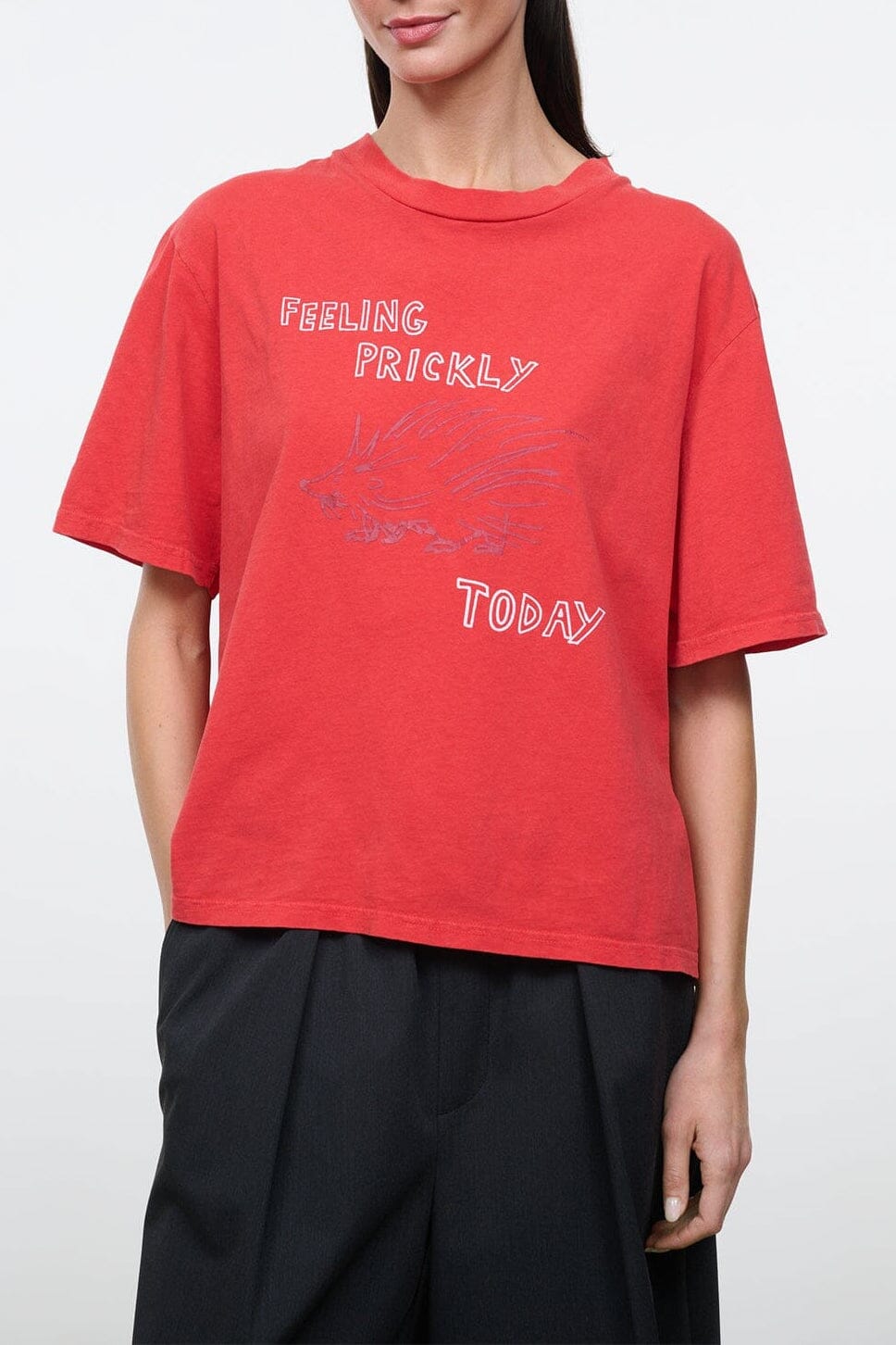 Red relaxed graphic tee with 'FEELING PRICKLY' and 'TODAY' print, crew neck