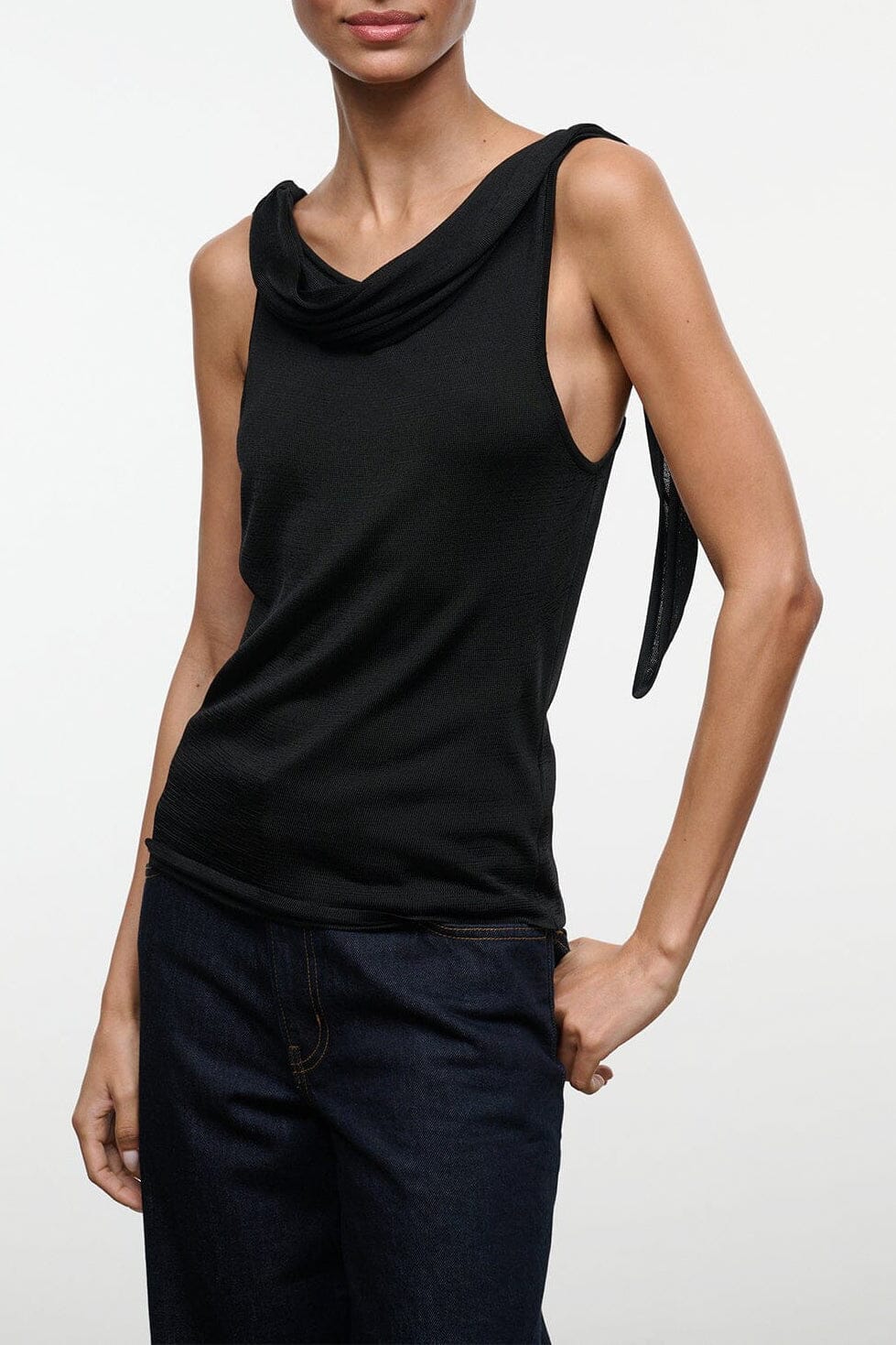 Black sleeveless cowl-neck top, draped neckline and fitted silhouette