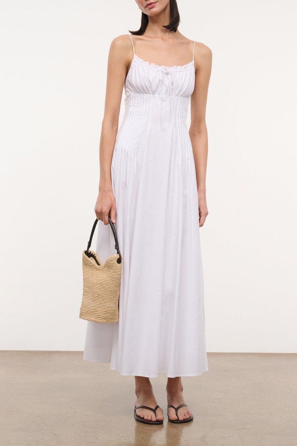 White sleeveless midi dress with gathered bust and thin straps