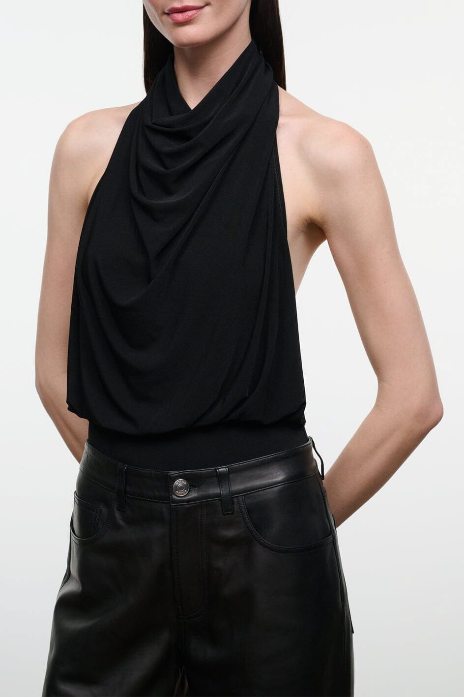Black draped halter bodysuit with sleeveless design and high neckline