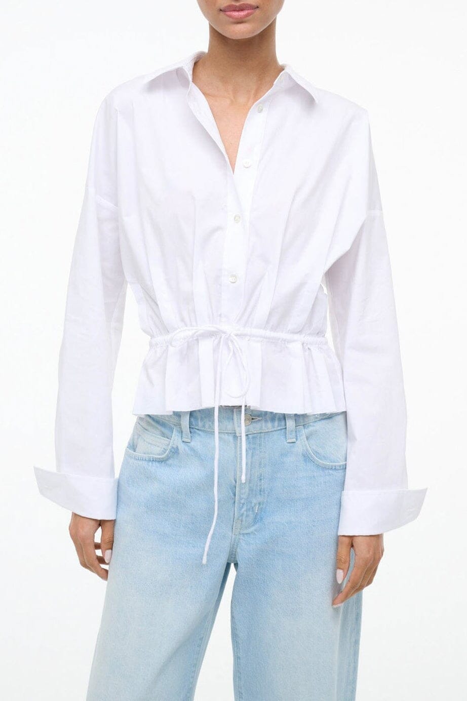White button-up shirt with spread collar, long sleeves, drawstring waist