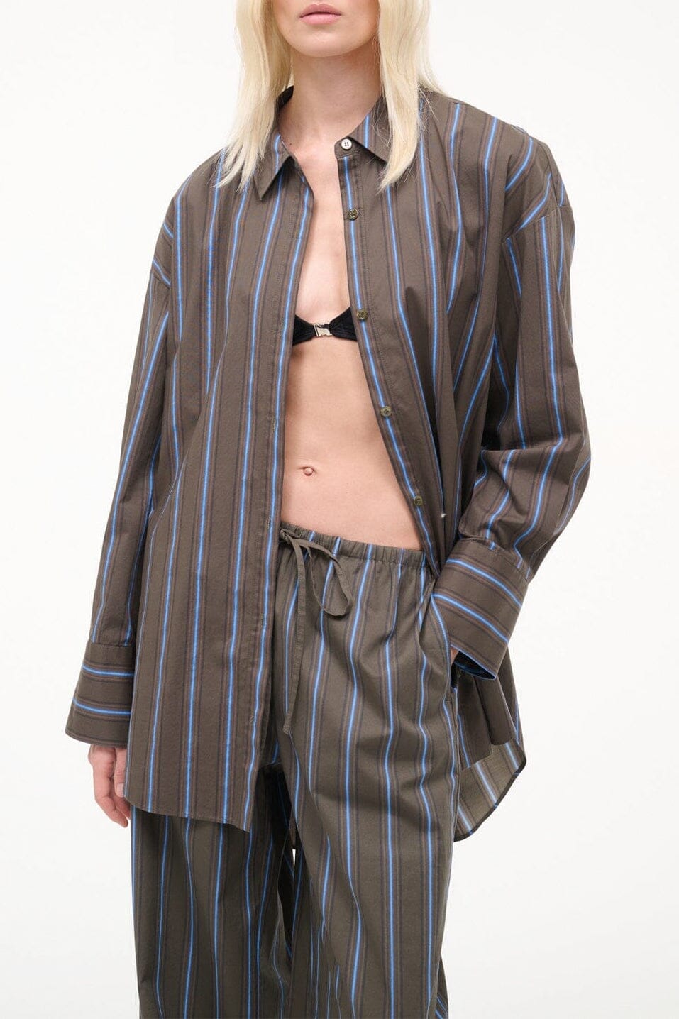 Navy vertical-striped button-up top with long sleeves and front placket
