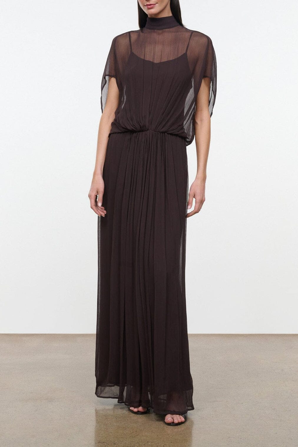 Dark brown sheer maxi dress with high neck, short sleeves, and gathered waist