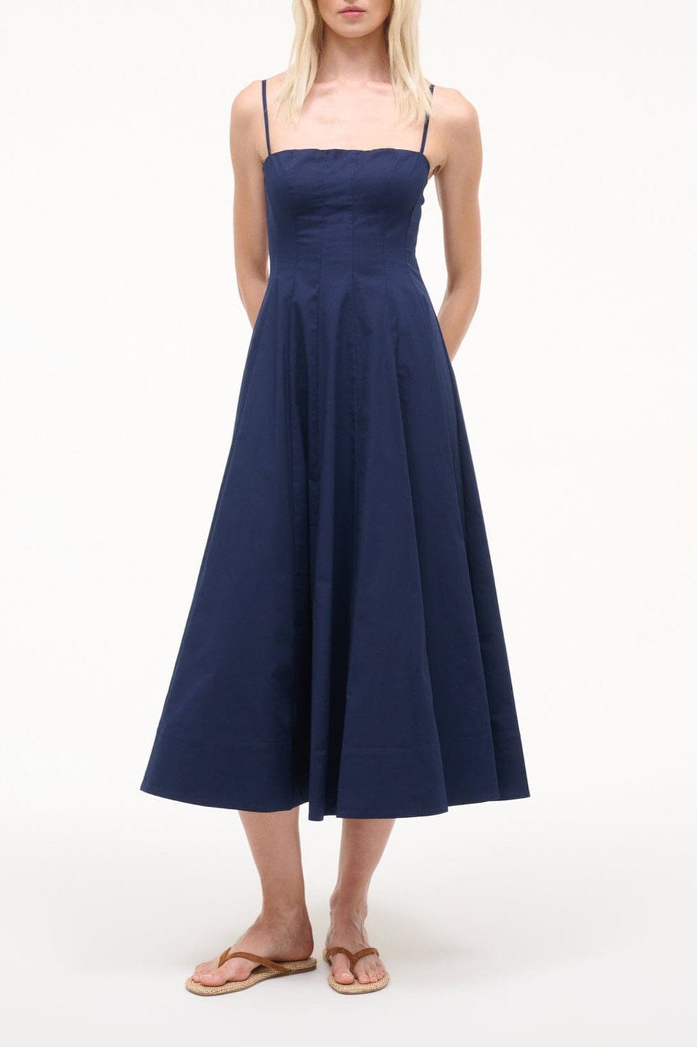 Navy sleeveless fit-and-flare dress with pleated skirt